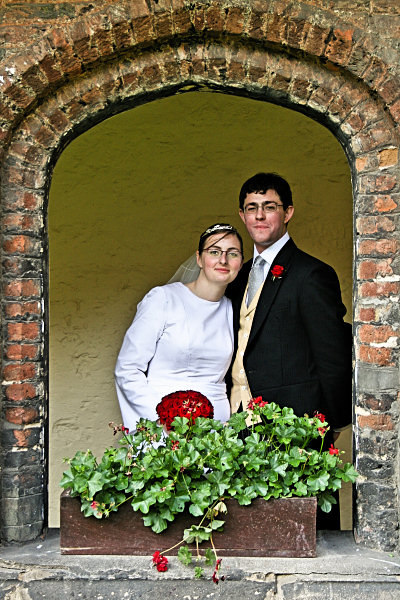 Wedding bride and groom in window arch
