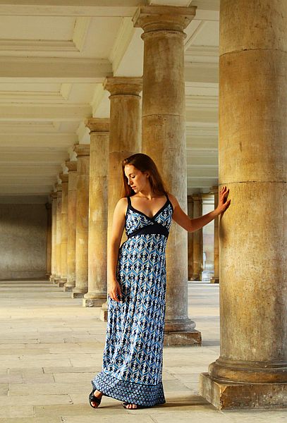Woman modelling against columns