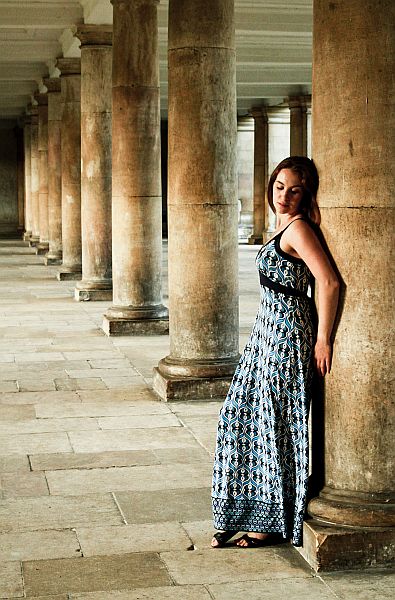 Woman modelling against columns